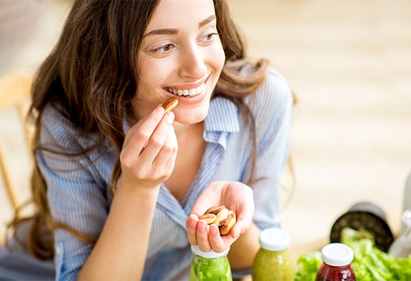 woman with diabetes snacking on nuts