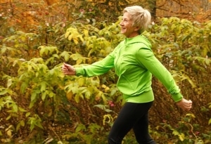 An older woman walking outside