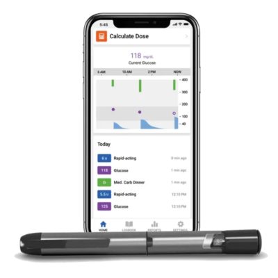 Medtronic® InPen™ Smart Insulin Pen in front of a smartphone with the Medtronic App