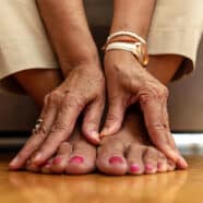 woman touching her feet to represent diabetes care