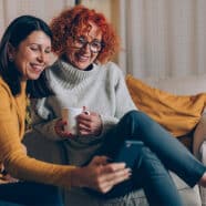 women laughing looking at diabetes hacks