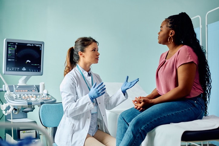 Physician answering questions about the benefits of CGM technology.